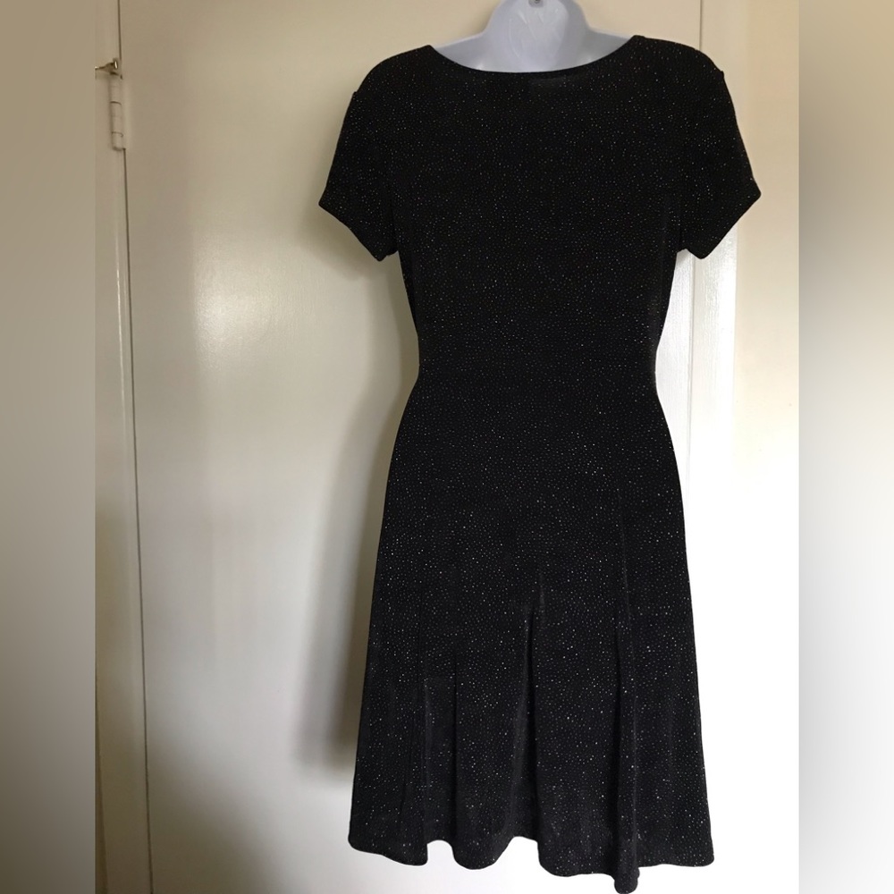 D.C.I by Cortney , size L , black with metallic dots all over the fabric
